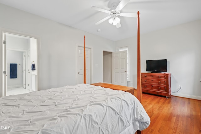 327 Commons Walk Cir, Cary, NC 27519 - bedroom featuring light wood-style flooring, ensuite bathroom, a ceiling fan, and baseboards