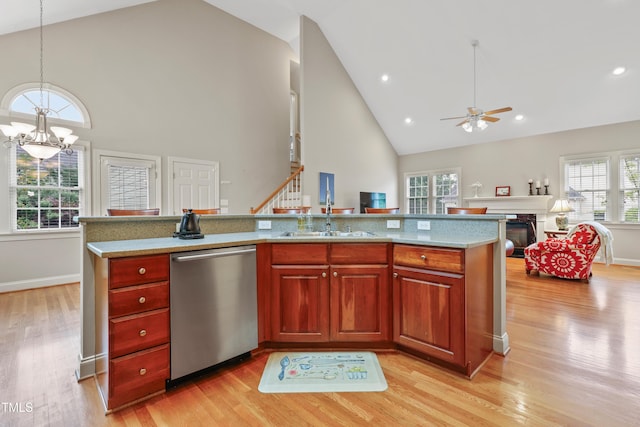 327 Commons Walk Cir, Cary, NC 27519 - kitchen with stainless steel dishwasher, a sink, high vaulted ceiling, ceiling fan, and light wood-type flooring