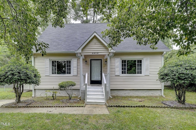 2012 Stadium Dr, Durham, NC 27705 - cape cod-style house featuring a front lawn and a shingled roof
