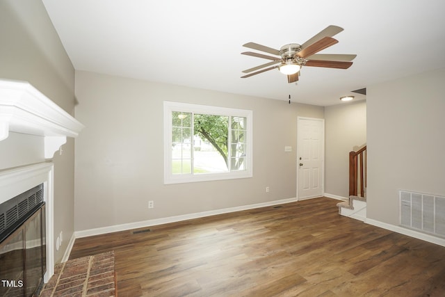 2012 Stadium Dr, Durham, NC 27705 - unfurnished living room featuring stairway, wood finished floors, a fireplace with flush hearth, and a ceiling fan
