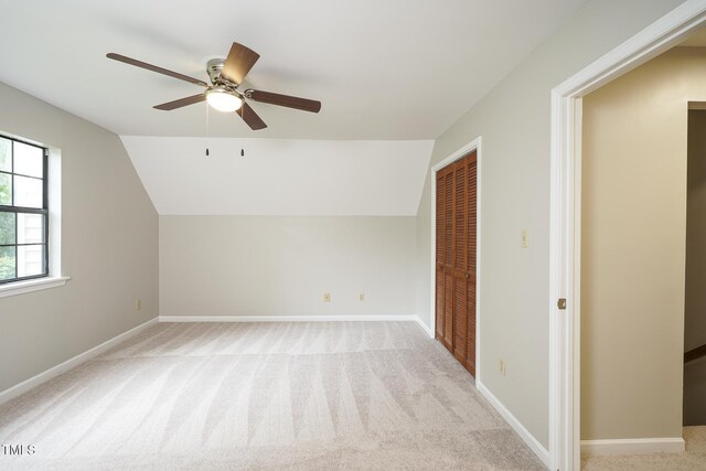 2012 Stadium Dr, Durham, NC 27705 - additional living space featuring ceiling fan, vaulted ceiling, light colored carpet, and baseboards