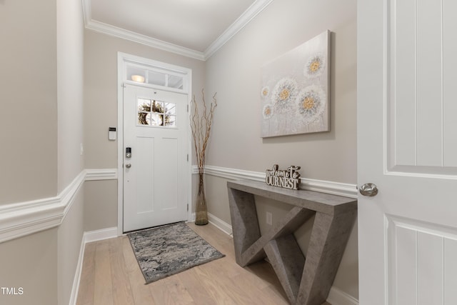 629 Newlyn Dr, Raleigh, NC 27606 - entrance foyer with crown molding, wood finished floors, and baseboards