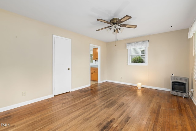 2015 Walnut St, Durham, NC 27705 - unfurnished bedroom with heating unit, wood finished floors, baseboards, and ensuite bath