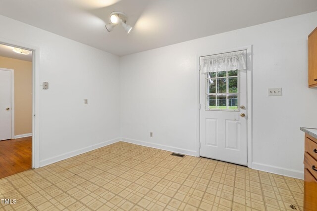2015 Walnut St, Durham, NC 27705 - foyer with baseboards and light floors