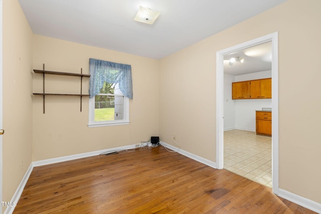 2015 Walnut St, Durham, NC 27705 - unfurnished room featuring light wood-type flooring and baseboards