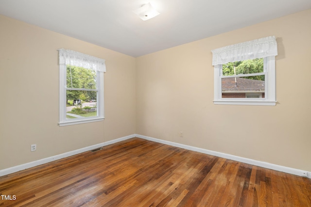 2015 Walnut St, Durham, NC 27705 - unfurnished room featuring healthy amount of natural light, baseboards, and wood finished floors