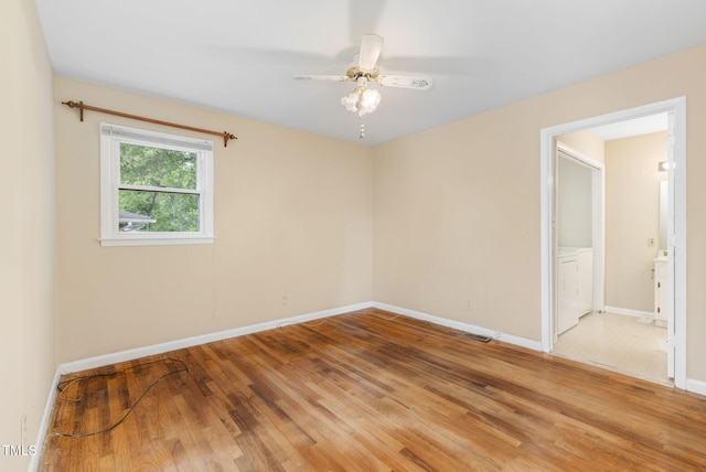 2015 Walnut St, Durham, NC 27705 - empty room featuring washer / dryer, baseboards, light wood-style floors, and ceiling fan
