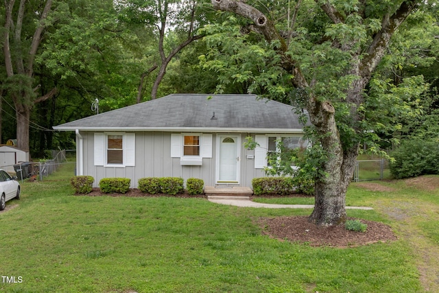 2015 Walnut St, Durham, NC 27705 - single story home with board and batten siding and roof with shingles