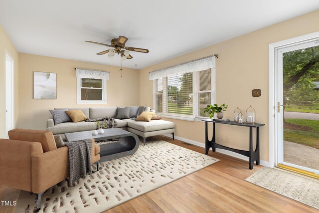 2015 Walnut St, Durham, NC 27705 - living area featuring plenty of natural light, wood finished floors, ceiling fan, and baseboards