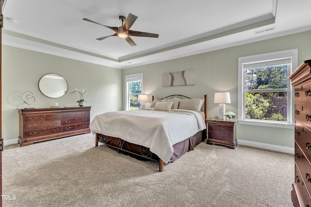 1716 Arberdour Dr, Apex, NC 27502 - carpeted bedroom with a raised ceiling, ornamental molding, multiple windows, baseboards, and a ceiling fan