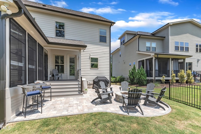 1716 Arberdour Dr, Apex, NC 27502 - rear view of house featuring an outdoor fire pit, a patio area, and a sunroom