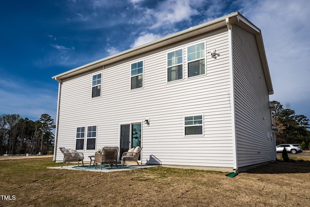 140 Enfield Dr, Carthage, NC 28327 - back of property with an outdoor hangout area, a lawn, and a patio