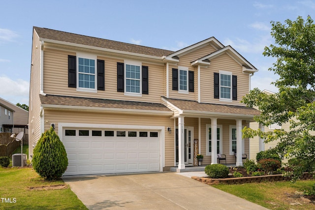 105 Putters Ct, Durham, NC 27703 - view of front of home featuring a garage, a porch, and concrete driveway