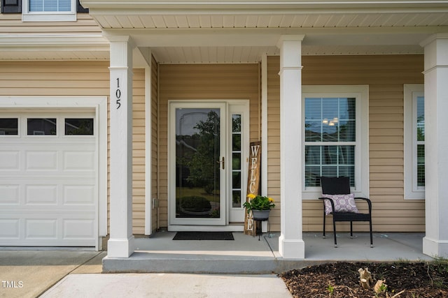 105 Putters Ct, Durham, NC 27703 - property entrance with a porch and a garage