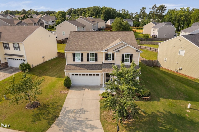 105 Putters Ct, Durham, NC 27703 - view of front of home with an attached garage, a residential view, concrete driveway, and a shingled roof