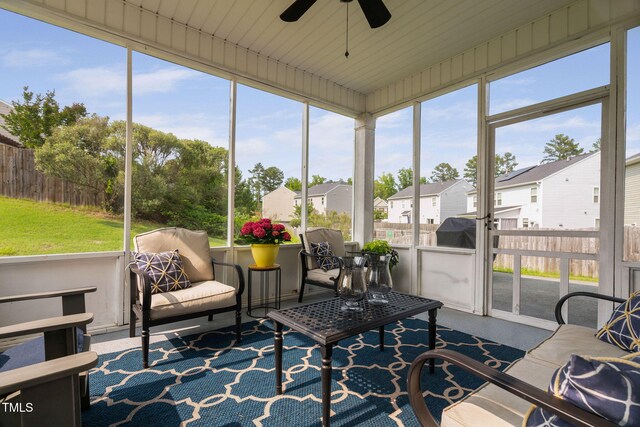 105 Putters Ct, Durham, NC 27703 - sunroom featuring a ceiling fan, a residential view, and an outdoor hangout area