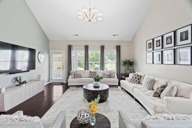 105 Putters Ct, Durham, NC 27703 - living area with high vaulted ceiling, wood finished floors, and a chandelier