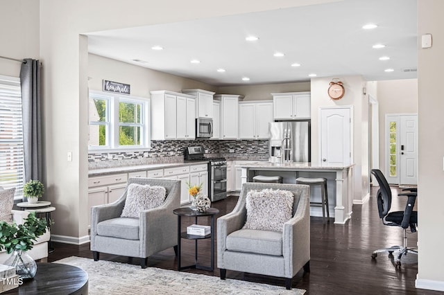 105 Putters Ct, Durham, NC 27703 - living area with dark wood finished floors and recessed lighting