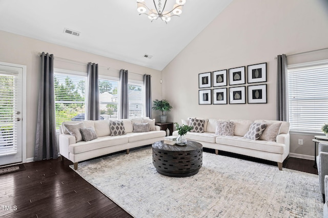105 Putters Ct, Durham, NC 27703 - living area featuring a chandelier, dark wood-style flooring, plenty of natural light, and high vaulted ceiling