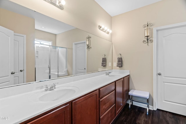 105 Putters Ct, Durham, NC 27703 - bathroom with double vanity, wood finished floors, and a stall shower