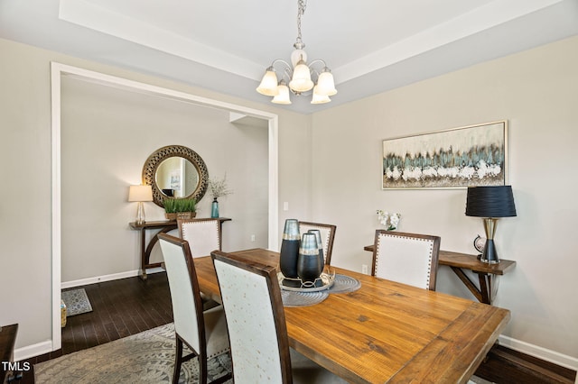 105 Putters Ct, Durham, NC 27703 - dining room with a chandelier, hardwood / wood-style flooring, and a tray ceiling