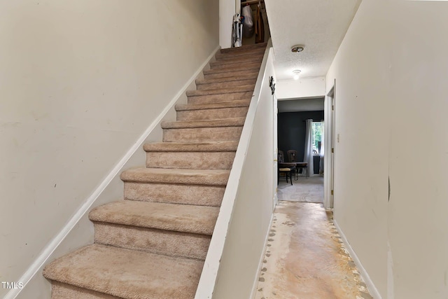 5931 Farm Gate Rd, Raleigh, NC 27606 - stairway with unfinished concrete floors