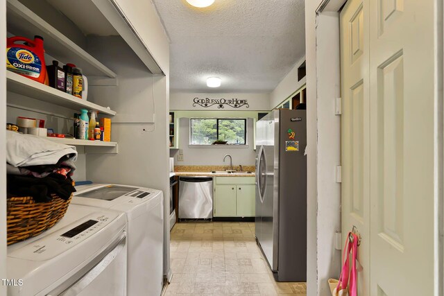 5931 Farm Gate Rd, Raleigh, NC 27606 - laundry area featuring washing machine and clothes dryer, a textured ceiling, cabinet space, and brick patterned floors