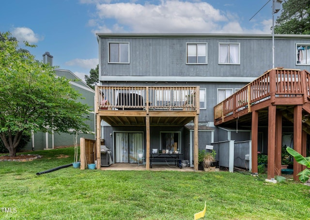 5931 Farm Gate Rd, Raleigh, NC 27606 - back of house featuring a lawn, a patio, and a wooden deck