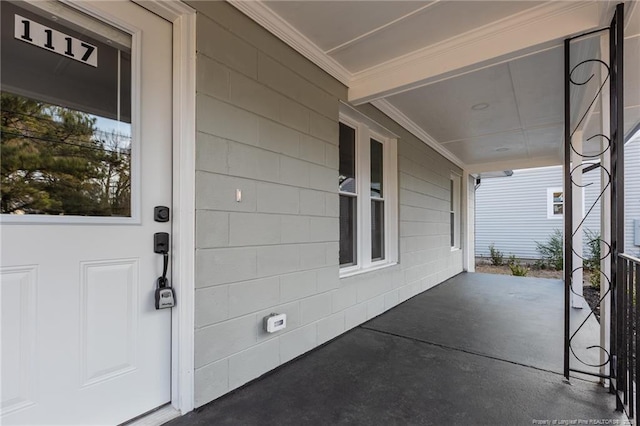 1117 Turnpike Rd, Fayetteville, NC 28305 - entrance to property featuring a porch and concrete block siding