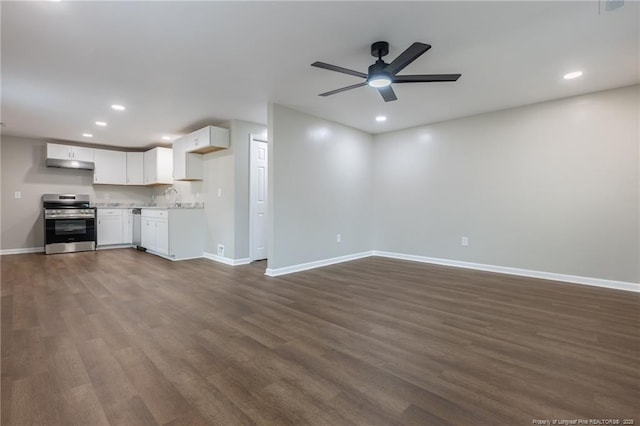 1117 Turnpike Rd, Fayetteville, NC 28305 - unfurnished living room featuring baseboards, dark wood finished floors, recessed lighting, a ceiling fan, and a sink