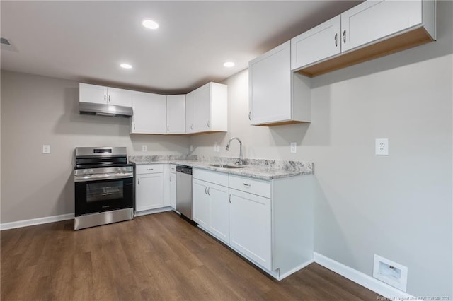 1117 Turnpike Rd, Fayetteville, NC 28305 - kitchen with appliances with stainless steel finishes, a sink, under cabinet range hood, baseboards, and dark wood-style flooring