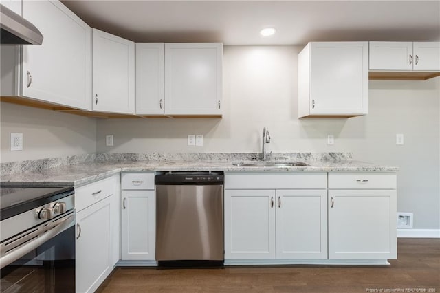 1117 Turnpike Rd, Fayetteville, NC 28305 - kitchen featuring appliances with stainless steel finishes, a sink, white cabinetry, range hood, and recessed lighting