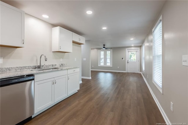 1117 Turnpike Rd, Fayetteville, NC 28305 - kitchen with stainless steel dishwasher, a sink, ceiling fan, dark wood-style flooring, and white cabinetry