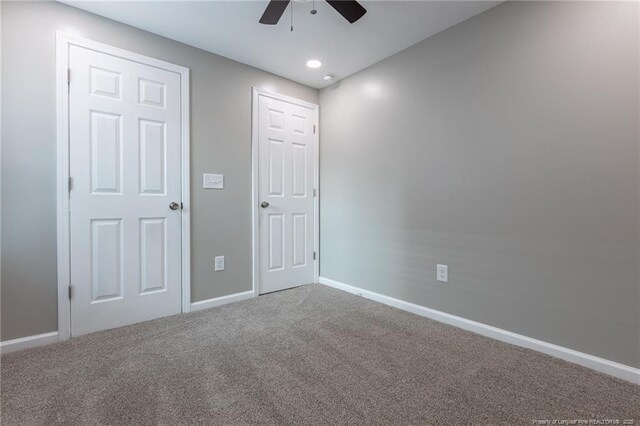 1117 Turnpike Rd, Fayetteville, NC 28305 - unfurnished bedroom with carpet flooring, baseboards, and a ceiling fan