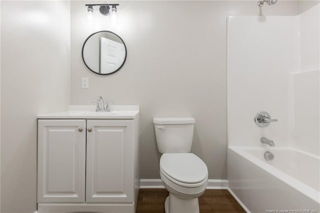 1117 Turnpike Rd, Fayetteville, NC 28305 - full bathroom with toilet, vanity, wood finished floors, shower / washtub combination, and baseboards
