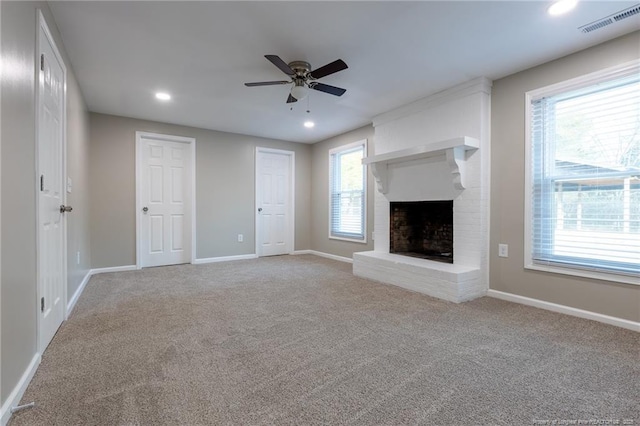 1117 Turnpike Rd, Fayetteville, NC 28305 - unfurnished living room featuring ceiling fan, carpet flooring, baseboards, a fireplace, and recessed lighting