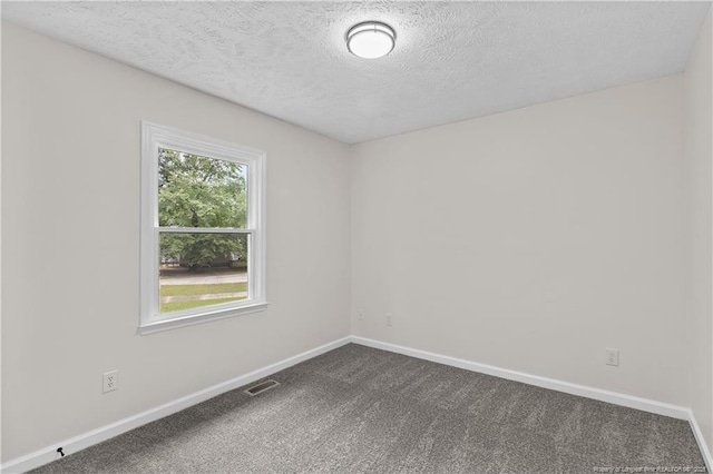 6241 Hedingham Dr, Hope Mills, NC 28348 - empty room with dark colored carpet, a textured ceiling, and baseboards