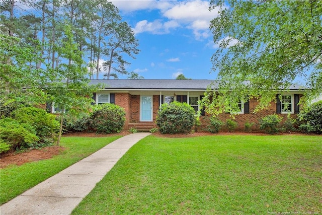 687 Blawell St, Stedman, NC 28391 - ranch-style home featuring brick siding and a front yard