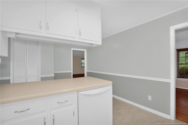687 Blawell St, Stedman, NC 28391 - kitchen featuring white dishwasher, white cabinetry, light countertops, baseboards, and crown molding