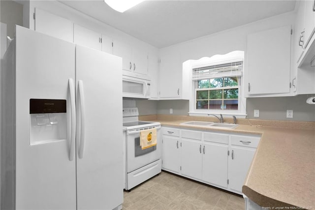 687 Blawell St, Stedman, NC 28391 - kitchen featuring white appliances, a sink, light countertops, and white cabinetry