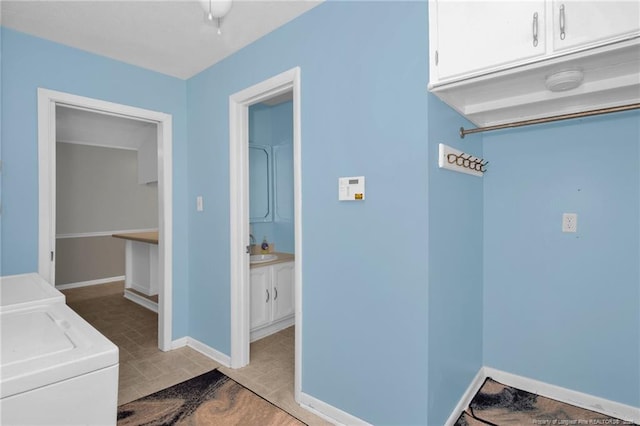 687 Blawell St, Stedman, NC 28391 - laundry room featuring cabinet space, washer and dryer, and baseboards