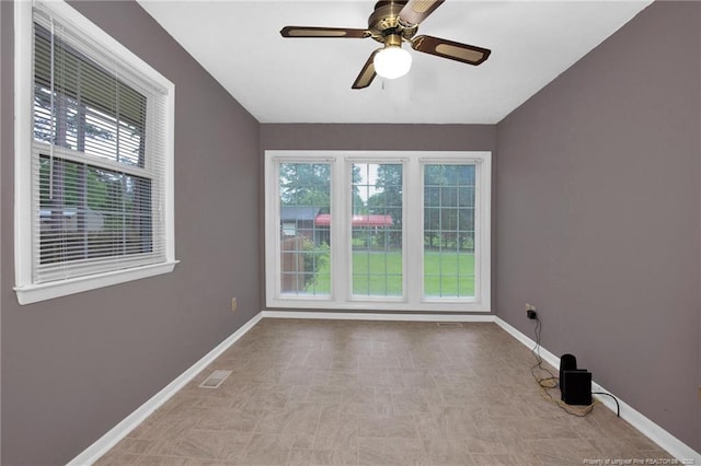 687 Blawell St, Stedman, NC 28391 - empty room featuring plenty of natural light, baseboards, a ceiling fan, and tile patterned floors