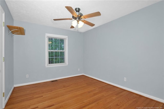 687 Blawell St, Stedman, NC 28391 - unfurnished room with wood finished floors, baseboards, and ceiling fan