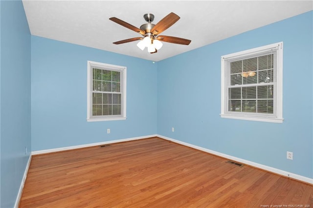 687 Blawell St, Stedman, NC 28391 - unfurnished room with wood finished floors, baseboards, and ceiling fan