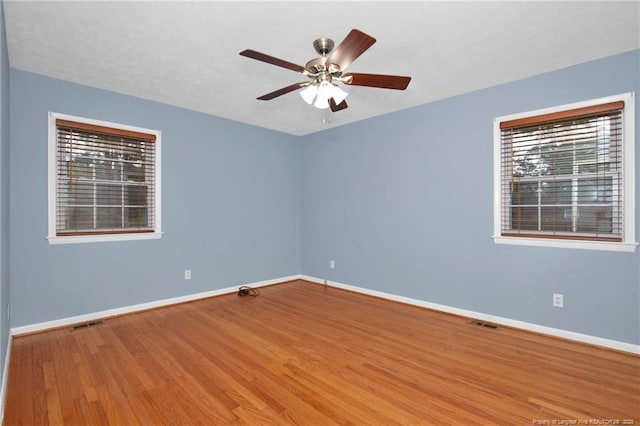 687 Blawell St, Stedman, NC 28391 - unfurnished room featuring baseboards, a ceiling fan, and wood finished floors
