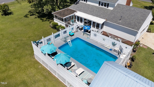 200 Mint Ct, Goldsboro, NC 27530 - view of swimming pool featuring a sunroom, a fenced backyard, and a deck