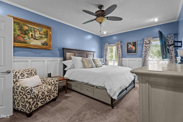 200 Mint Ct, Goldsboro, NC 27530 - bedroom with crown molding, a textured ceiling, carpet, a wainscoted wall, and a decorative wall
