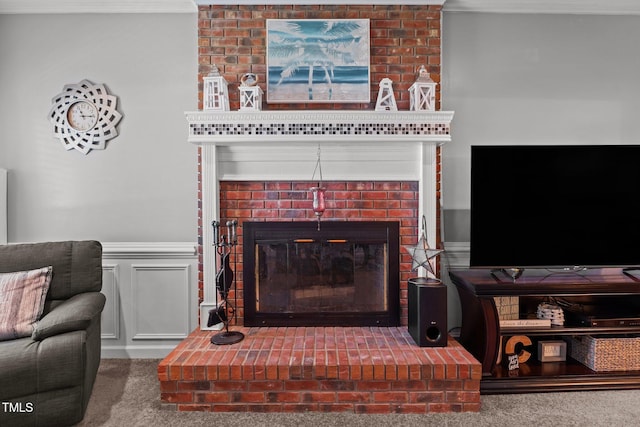 200 Mint Ct, Goldsboro, NC 27530 - carpeted living area with a fireplace, wainscoting, and crown molding