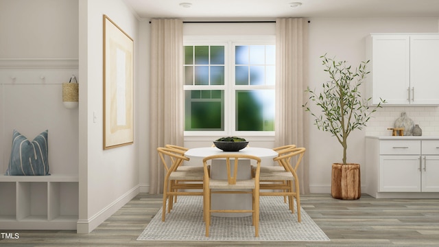 880 Cassa Clubhouse Way, Knightdale, NC 27545 - dining room featuring light wood-style flooring and baseboards
