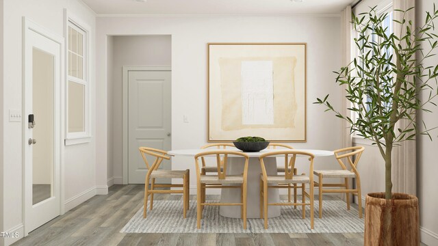 880 Cassa Clubhouse Way, Knightdale, NC 27545 - dining room featuring wood finished floors, crown molding, and baseboards